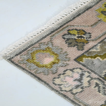 Close-up of a patterned rug with geometric design on a white background