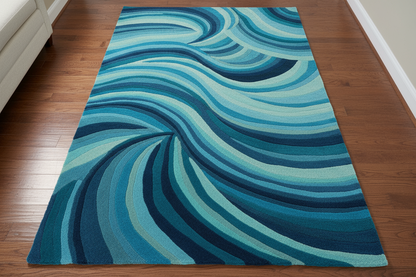 Blue wavy patterned rug on a wooden floor