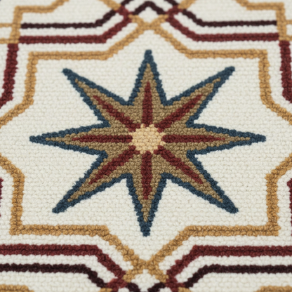 Handmade ivory rug with striking star motifs and deep blue border.