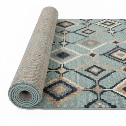 Roll of patterned rug with geometric design on a white background