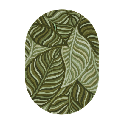 Green and white leaf patterned rug on a light gray background