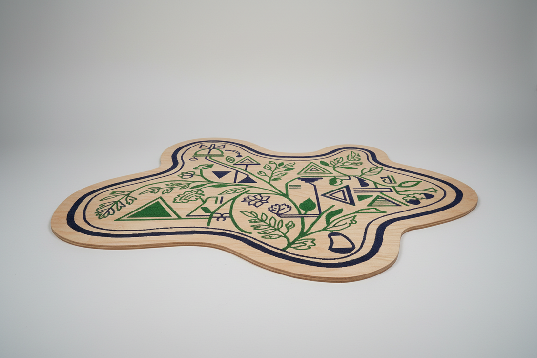 Irregular shaped hand-tufted rug with green floral and geometric patterns on a beige base.