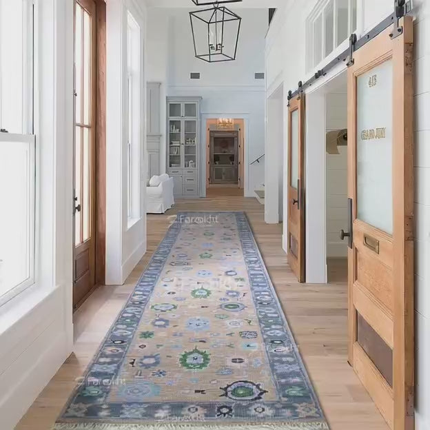 runner Long decorative rug on a wooden floor in a home interior with sliding doors and windows.