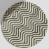Round beige rug with black wavy geometric lines